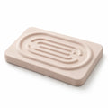 Porte-savon Convex SOVO en diatomite beige présenté seul sur fond blanc